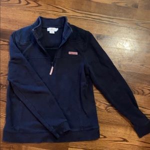 A navy blue vineyard vines quarter zip jacket